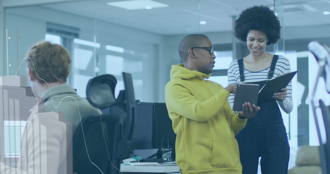 Diverse Professionals Discussing Business Data in Modern Office