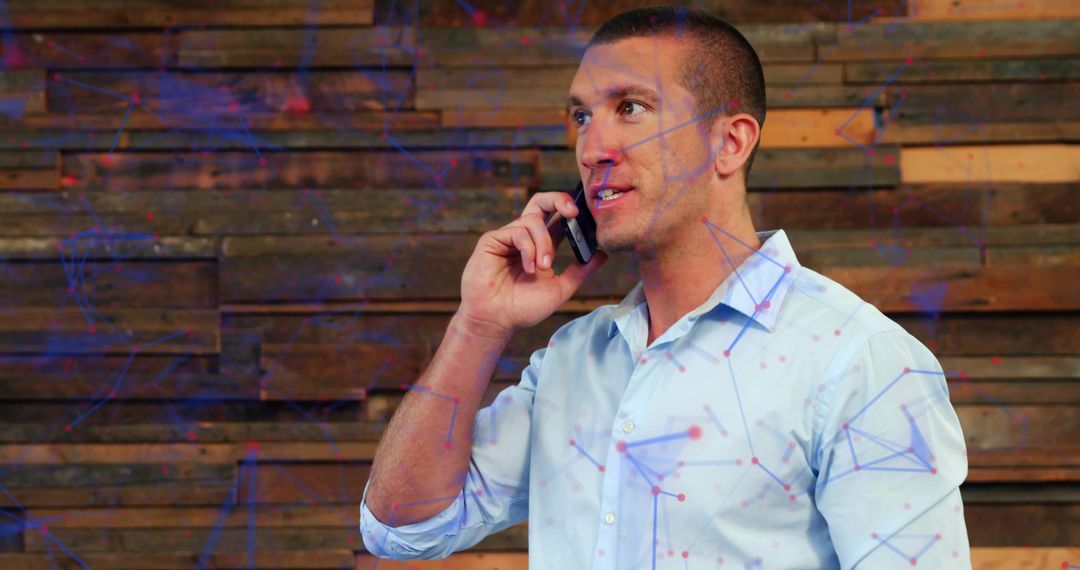 Business Professional Engaging in Phone Conversation with Network Technology Overlay