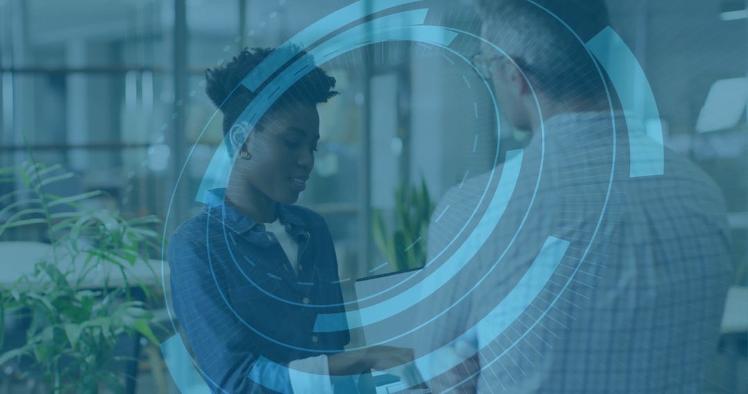 Professionals Collaborating with Digital Interface Overlay in Modern Office