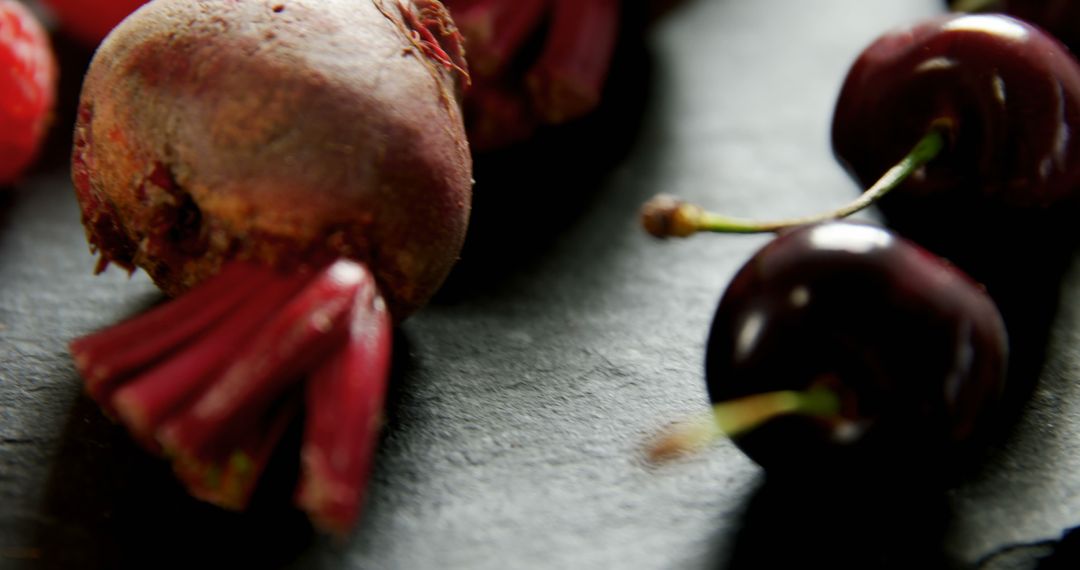 Close-Up of Fresh Beets and Cherries on Dark Surface - Free Images, Stock Photos and Pictures on Pikwizard.com