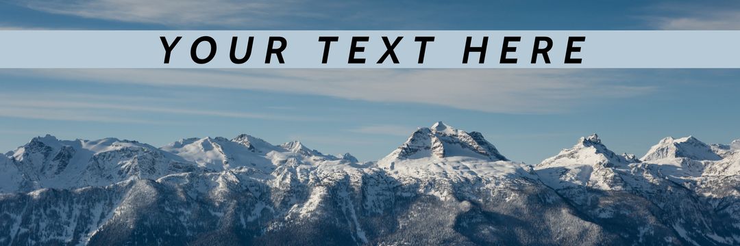 Snow-Capped Mountain Range Under Clear Blue Sky