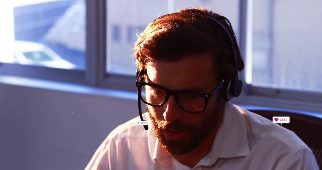 Businessman Using Headset for Customer Communication in Office