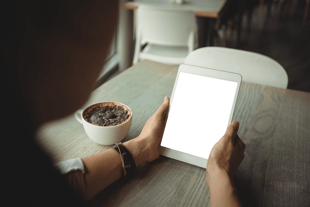 Transparent Tablet Lifestyle with Coffee in Cozy Cafe