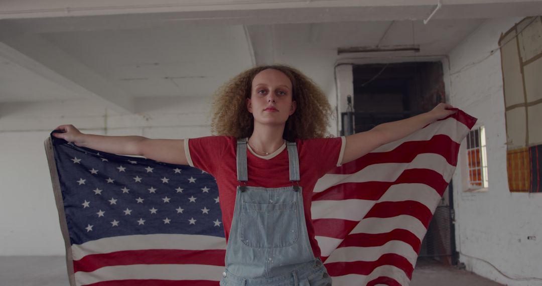 Young Woman Holding American Flag in Urban Loft - Free Images, Stock Photos and Pictures on Pikwizard.com