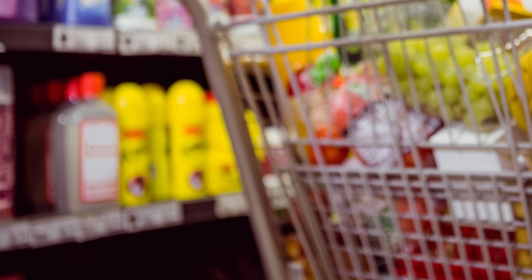 Blurred Shopping Cart in Vibrant Grocery Store Aisle