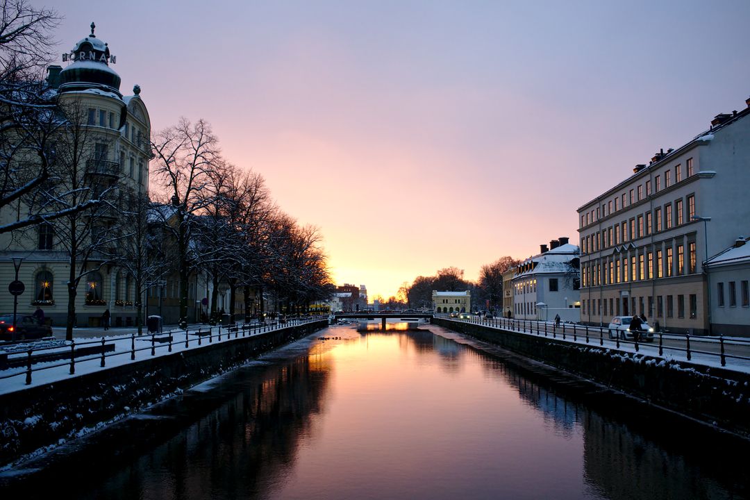 Winter Sunrise Over Peaceful City Canal - Free Images, Stock Photos and Pictures on Pikwizard.com