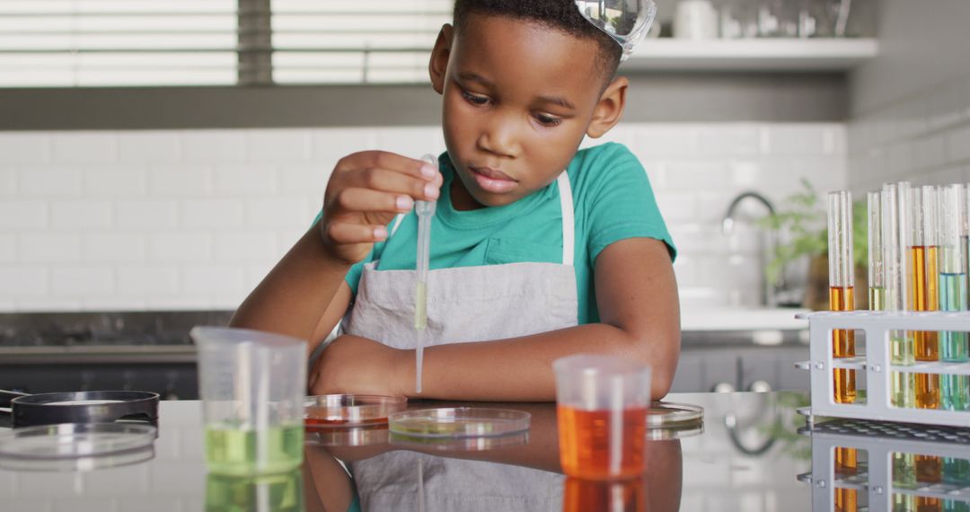 Young Boy Conducting a Science Experiment at Home - Free Images, Stock Photos and Pictures on Pikwizard.com