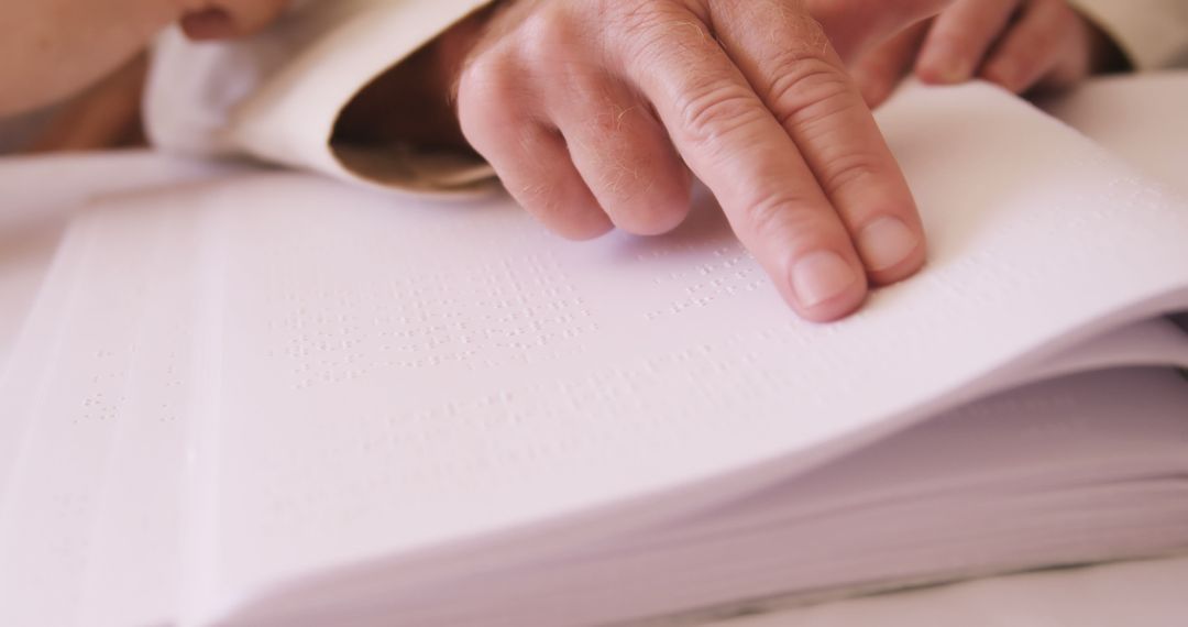 Close-up of Hands Reading Braille on White Paper - Free Images, Stock Photos and Pictures on Pikwizard.com