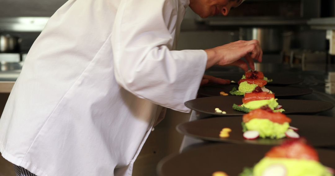 Chef Preparing Elegant Gourmet Plates in Professional Kitchen - Free Images, Stock Photos and Pictures on Pikwizard.com