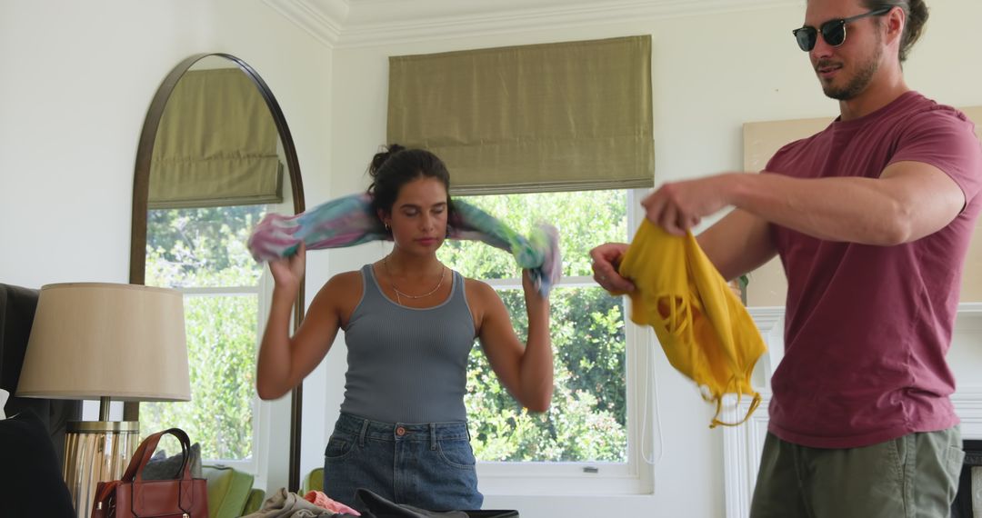 Couple Packing Clothes at Home for Wedding Celebration