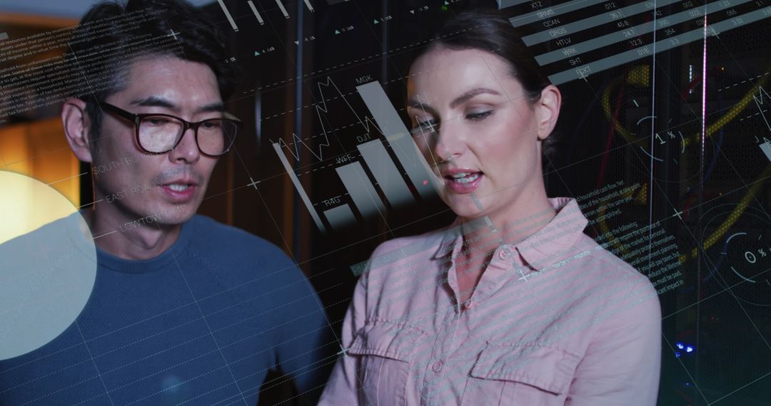 Diverse IT Engineers Analyzing Data on Tablet Near Server Room