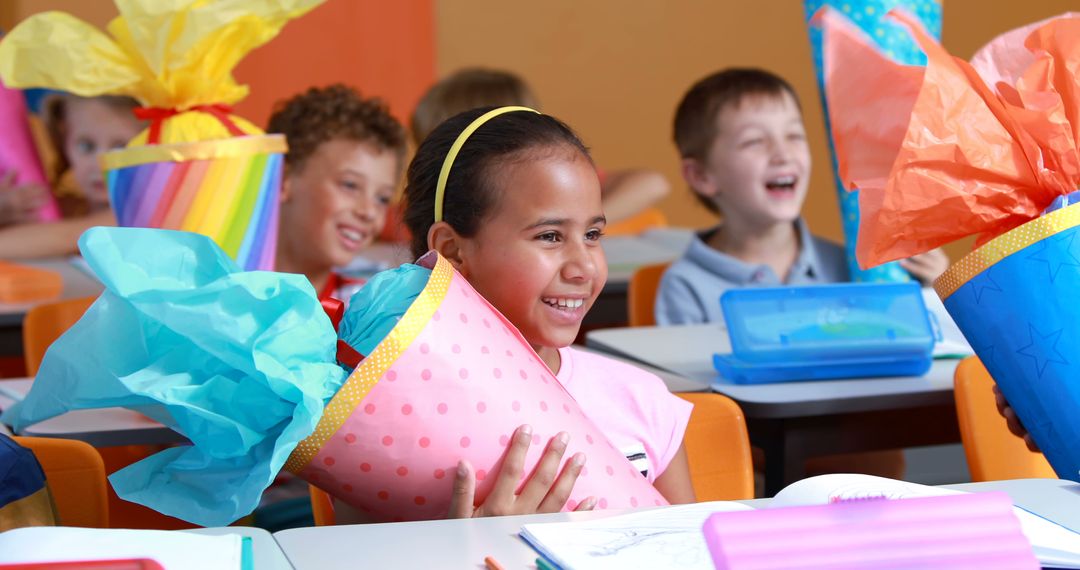 Excited Children Enjoying Gift-Wrap Day in Classroom - Free Images, Stock Photos and Pictures on Pikwizard.com