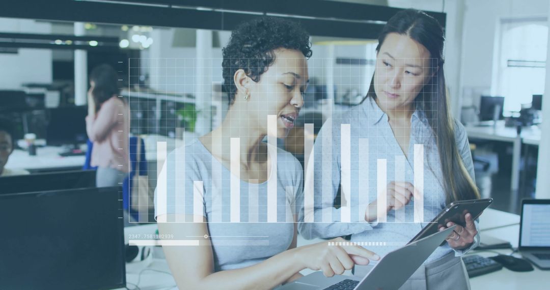 Diverse Professionals Analyzing Digital Financial Data in Modern Office