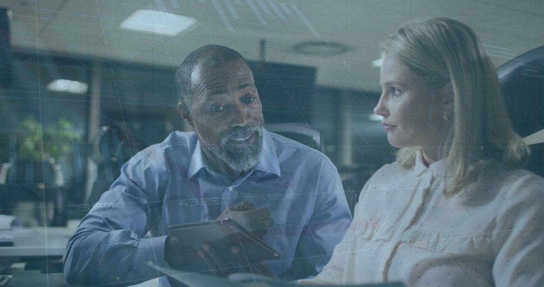Diverse Business Colleagues Analyzing Data in Realtime at Office