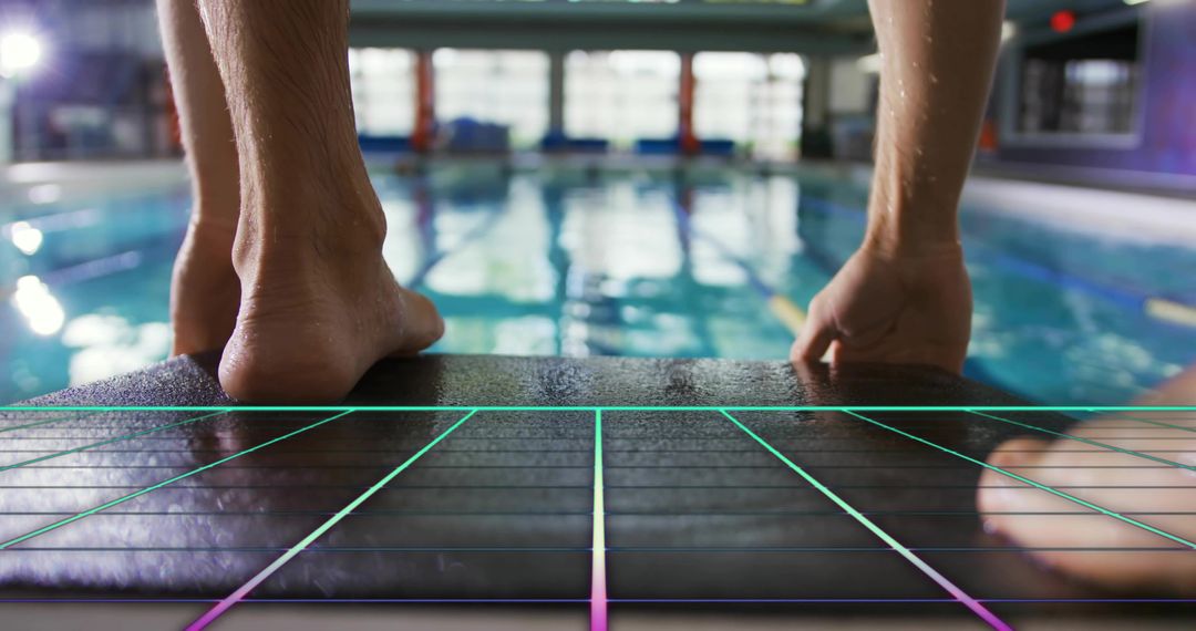 Male Swimmer Positioning on Starting Block Preparing for Competitive Dive with Neon Grid
