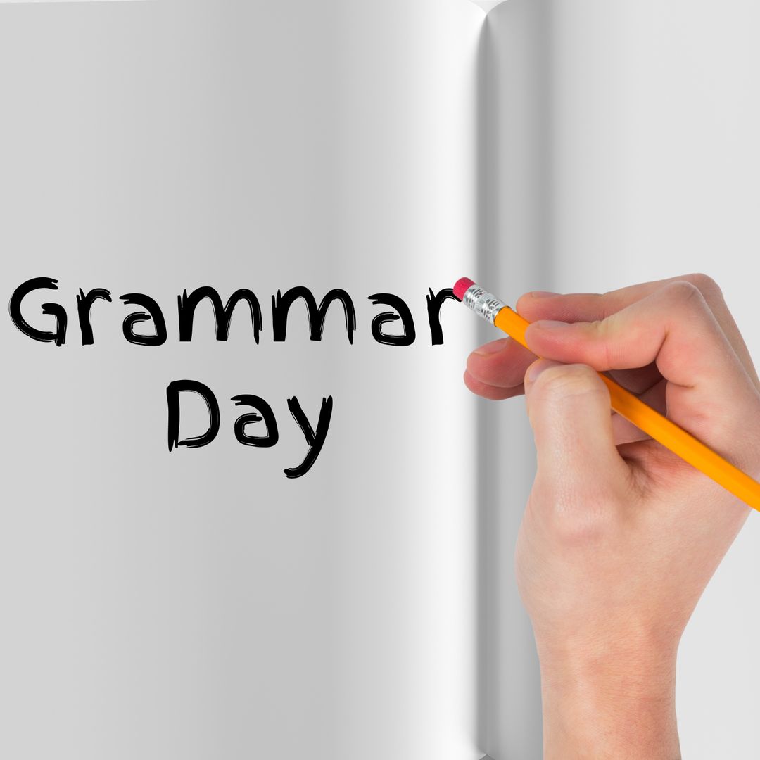 Hand Holding Pencil Editing Grammar Text on Open Book Page