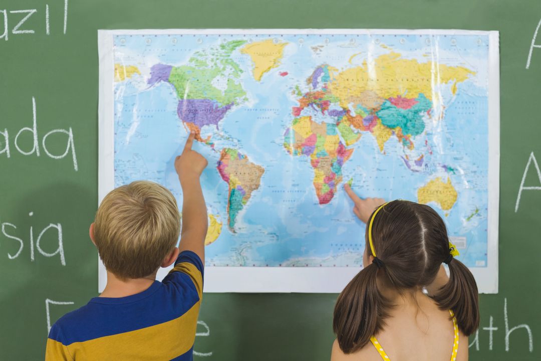 School Kids Pointing at World Map in Classroom - Free Images, Stock Photos and Pictures on Pikwizard.com