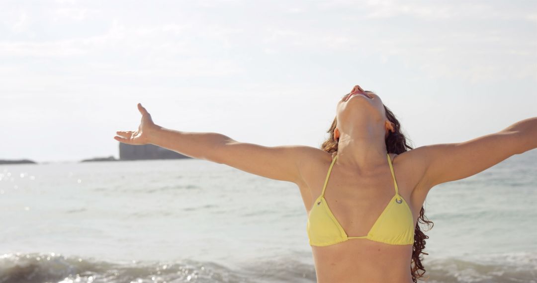 Woman Enjoying Freedom at Beach With Open Arms - Free Images, Stock Photos and Pictures on Pikwizard.com