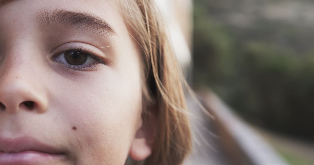 Close-Up of Smiling Child Outdoors in Natural Light