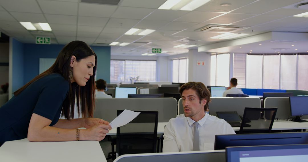 Collaborative Office Discussion Between Colleagues