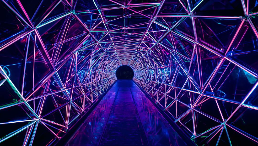 Neon Triangular Lattice Tunnel with Magenta Cyan LED Reflections and Symmetry