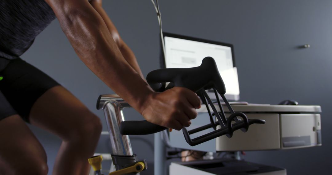 Man Using Stationary Bike in Modern Gym - Free Images, Stock Photos and Pictures on Pikwizard.com