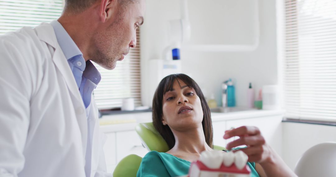 Dentist Consulting Patient in Clinic - Free Images, Stock Photos and Pictures on Pikwizard.com