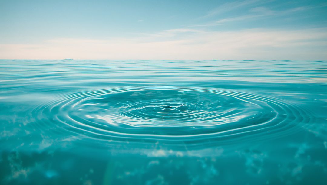 Calm Ocean Ripples Under Soft Sky