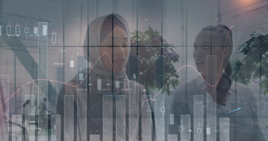 Businesswomen Analyzing Financial Data with Digital Interface