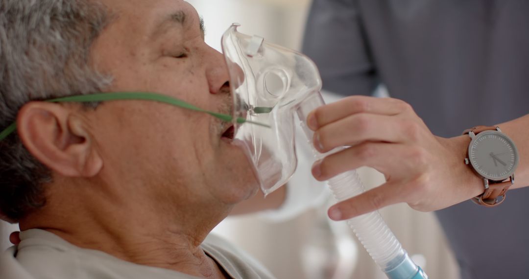 Nurse Assisting Elderly Man with Oxygen Mask - Free Images, Stock Photos and Pictures on Pikwizard.com