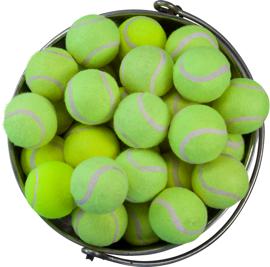 Close-up of Lime Yellow Tennis Balls in Transparent Bucket - Download Free Stock Images Pikwizard.com