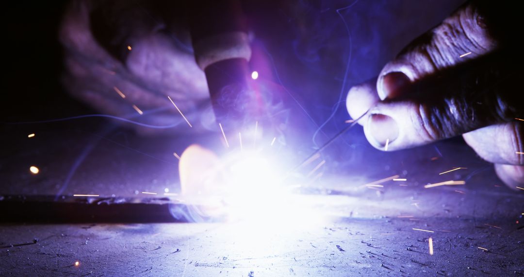 Close-up of Welder's Hands Working with Sparks and Bright Light - Free Images, Stock Photos and Pictures on Pikwizard.com