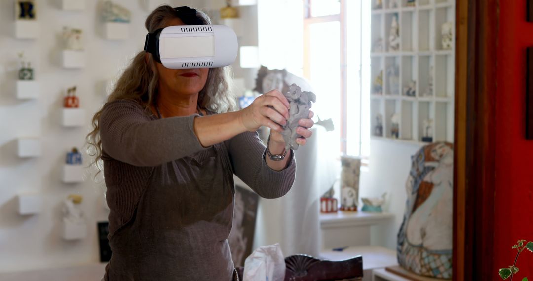 Senior Woman Creating Art Using Virtual Reality Headset in Studio - Free Images, Stock Photos and Pictures on Pikwizard.com