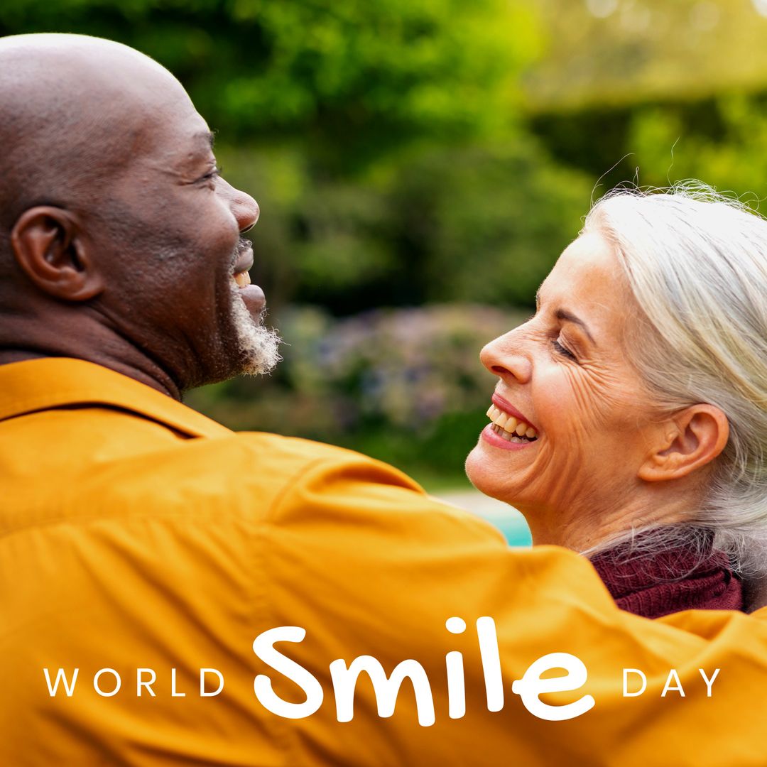 Joyful Senior Couple Embracing on World Smile Day Outdoors