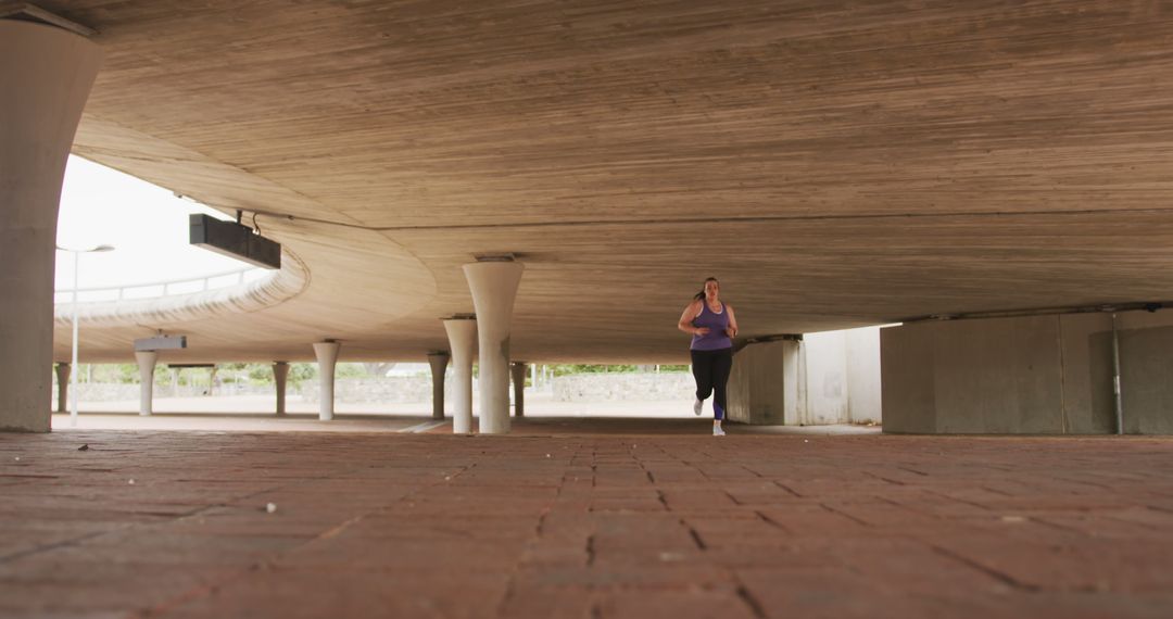 Woman Running Under Bridge - Free Images, Stock Photos and Pictures on Pikwizard.com