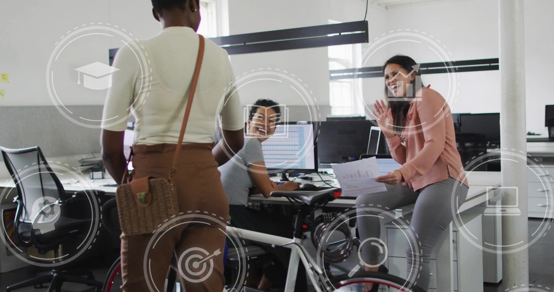 Coworkers collaborating while pedaling desk bike and reviewing documents in office