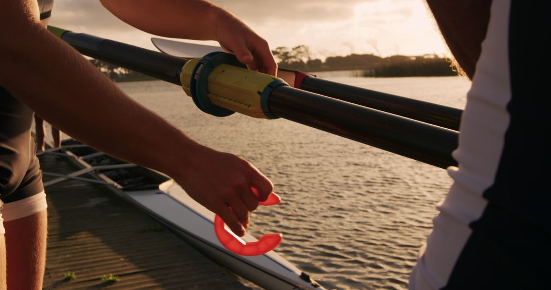 Rowers Assembling Oars by Lake During Sunset - Free Images, Stock Photos and Pictures on Pikwizard.com