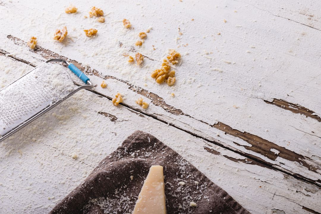 Grated Cheese with Walnuts on Rustic Wooden Table