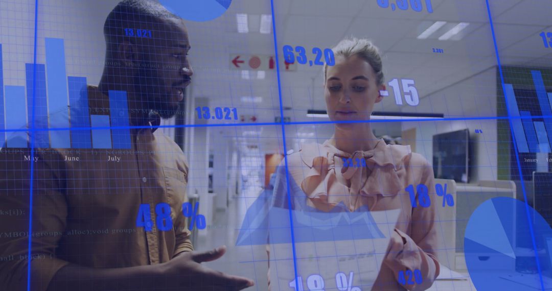 Diverse Professionals Analyzing Data and Charts in Modern Office