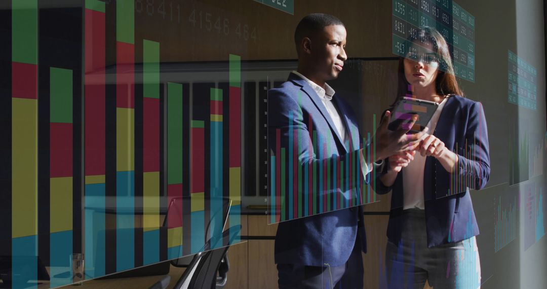 Diverse Business Team Analyzing Financial Data Projections in Modern Office