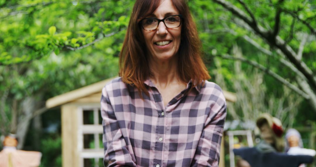 Caucasian Woman Smiling in Garden with Relaxed Atmosphere