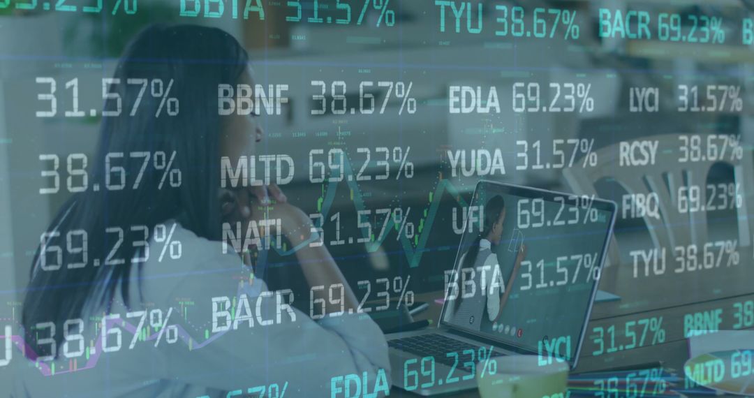 Focusing Woman Analyzing Real-time Stock Data on Laptop in Modern Office