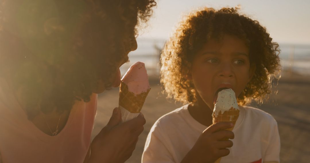 Mother and child enjoying ice cream at beach - Free Images, Stock Photos and Pictures on Pikwizard.com