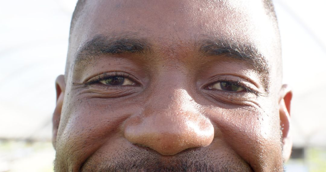 Close-up Portrait of Man with Thoughtful Expression and Gentle Smile