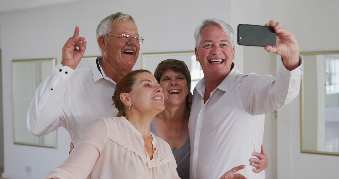 Happy Senior Friends Taking a Selfie Indoors - Free Images, Stock Photos and Pictures on Pikwizard.com