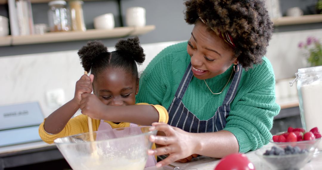 Joyful African American Mother and Daughter Baking Together at Home - Free Images, Stock Photos and Pictures on Pikwizard.com