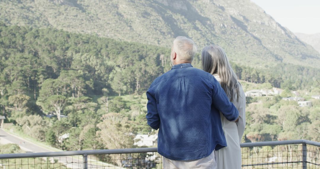 Senior Couple Enjoying Scenic Mountain View on Balcony - Free Images, Stock Photos and Pictures on Pikwizard.com