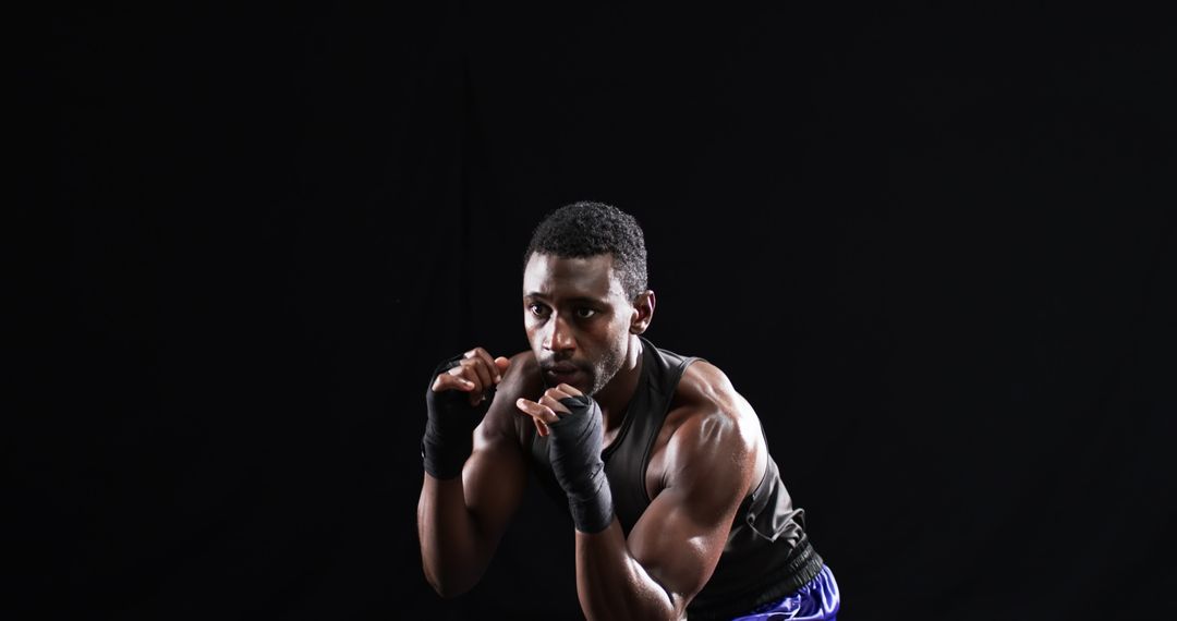 Focused Athlete in Boxing Stance Demonstrating Intense Training Session