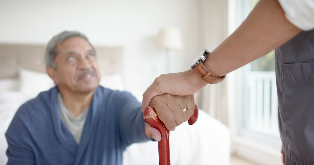 Elderly Man Receiving Help from Caregiver Inside Cozy Home - Free Images, Stock Photos and Pictures on Pikwizard.com