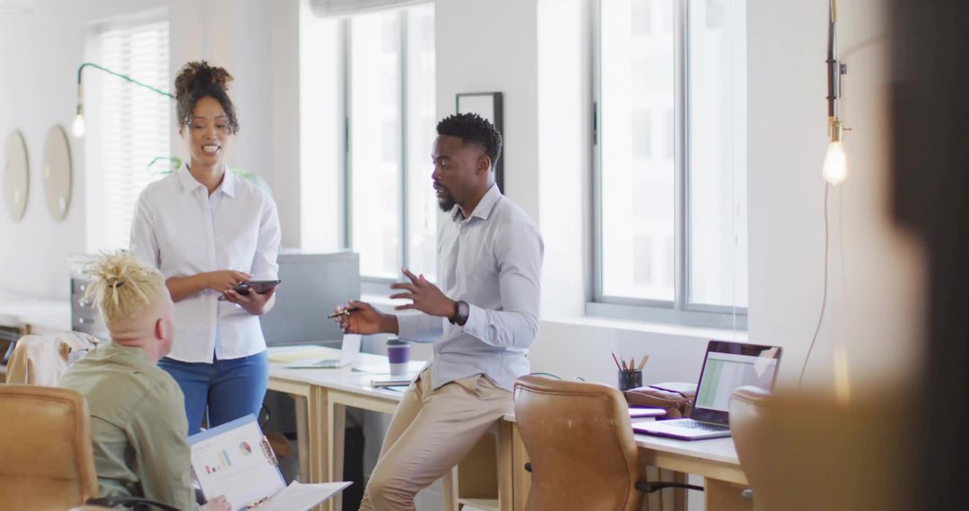 Diverse Team Collaborating in Modern Open-Plan Workspace